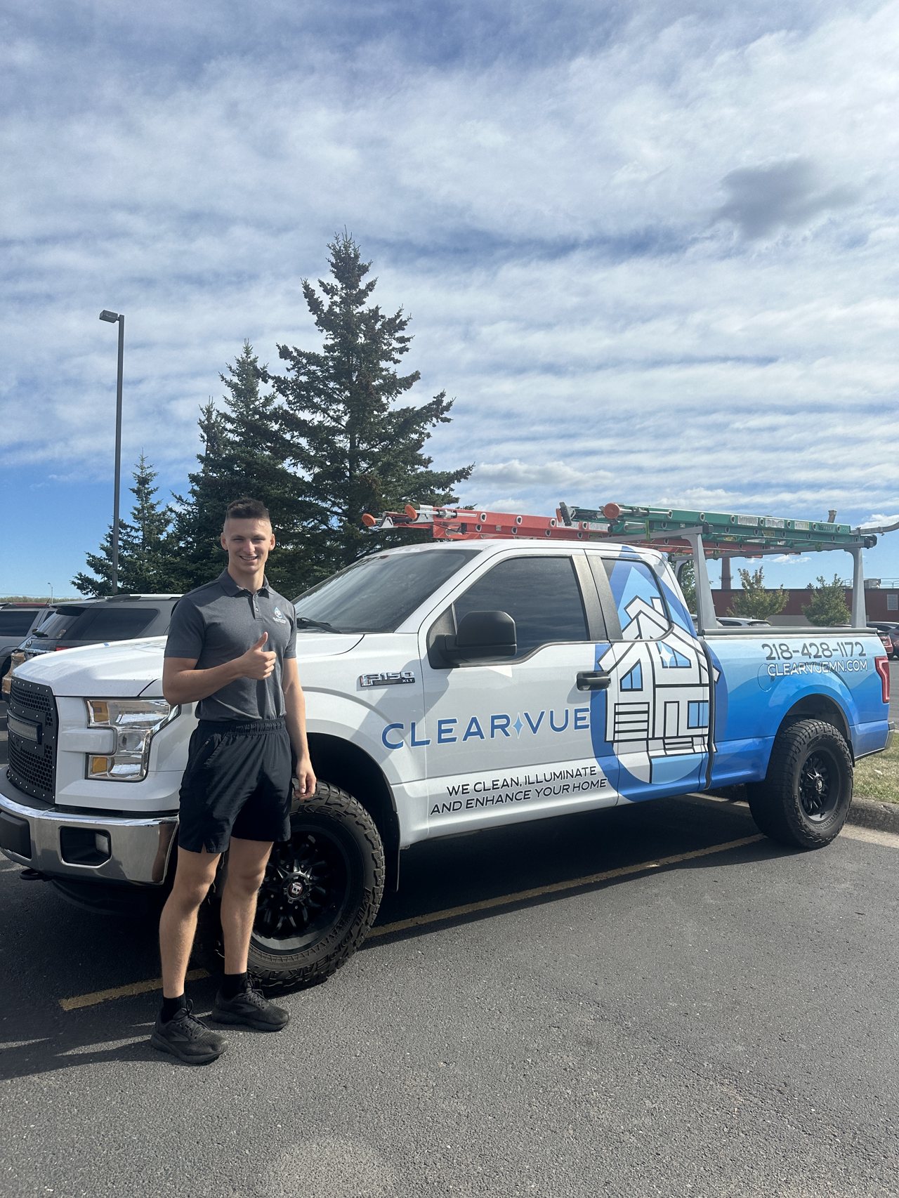 Clear Vue crew member with the company truck, Two Harbors